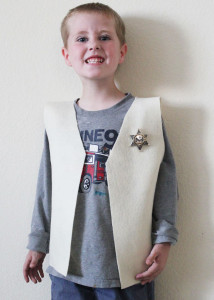 cowboy vest and a cheezy smile