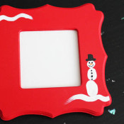 Thumbprint Snowman Frame at 30 Minute Crafts