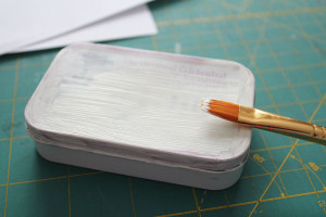 paint altoids tin with two coats of white