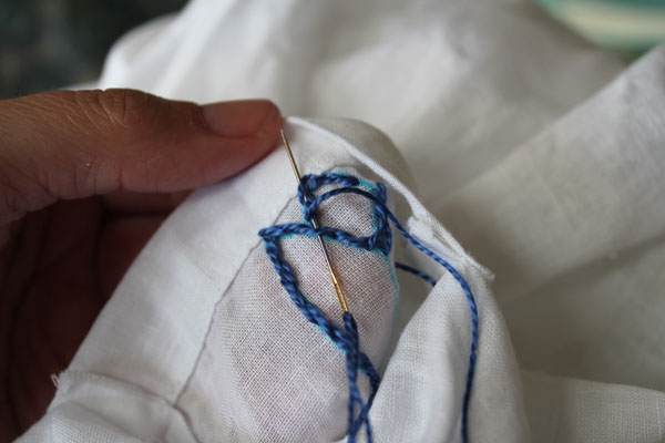on the back to hide stitches
