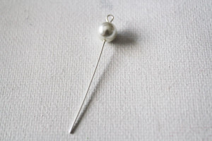 thread a pearl onto the eye pin