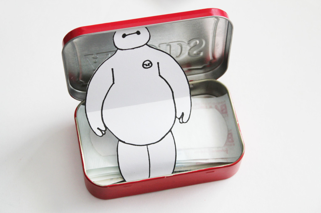 baymax in a bandaid tin image