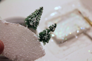 add glitter and mod podge to trees