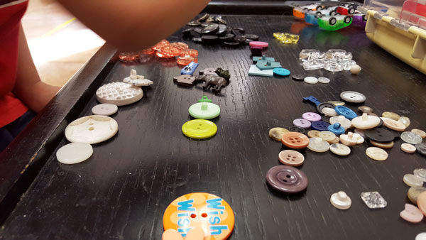 put buttons into piles
