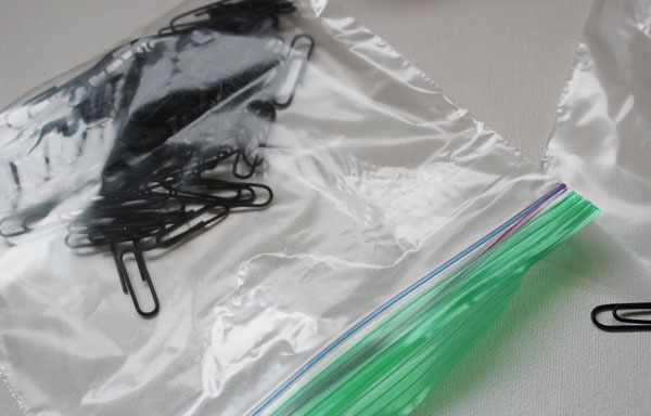 put paper clips in plastic bag