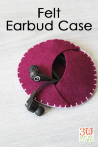 DIY Felt Earbud Case - this little earbud case is super simple to stitch up, and so handy! The perfect way to store your earbuds and keep cords from getting tangled!