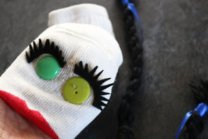 glue hair on sock puppet
